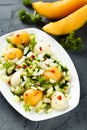 Refreshing melon salad with cucumber and chili