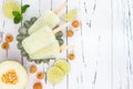 Refreshing mexican style ice pops - raspberry, lime, honeydew margarita paletas - popsicles. Top view. Cinco de Mayo recipe