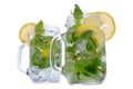 Refreshing mint and lemon drink in glass jars