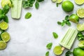 Refreshing Mint and Lime Popsicles Surrounded by Fresh Limes and Mint Leaves on a Light Background Royalty Free Stock Photo