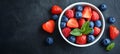 Refreshing Mixed Berries Fruit Salad with Strawberries, Raspberries, and Blueberries in a Bowl Royalty Free Stock Photo
