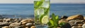 Refreshing mojito cocktail on sunny beach background, tropical summer drink concept Royalty Free Stock Photo
