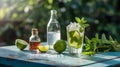 Refreshing Mojito Ingredients: Limes, Fresh Mint, Salt, Syrup, and Sparkling Water on a Rustic Blue Table in Bright Sunlight Royalty Free Stock Photo