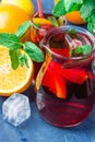 Refreshing Non-Alcoholic Spanish Sangria from Variety of Fruits Orange Citrus Pomegranate Grapes Berries and Fresh Mint in Pitcher Royalty Free Stock Photo