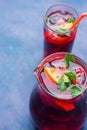 Refreshing Non-Alcoholic Spanish Sangria from Variety of Fruits Orange Citrus Pomegranate Grapes Berries and Fresh Mint in Jug Royalty Free Stock Photo