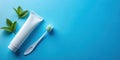 Refreshing oral hygiene mint-flavored toothpaste and toothbrush on blue background. Generative AI Royalty Free Stock Photo