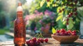 A refreshing outdoor summer scene with a chilled cherry beer bottle on a garden table, accompanied by a bowl of ripe Royalty Free Stock Photo