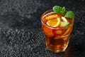 Refreshing Pimms Cocktail with Fruit and vegetables on rustic black table Royalty Free Stock Photo