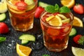 Refreshing Pimms Cocktail with Fruit and vegetables on rustic black table Royalty Free Stock Photo