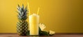 Refreshing pineapple juice in glass on wooden table with soft yellow background for text placement