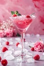 Pink Drink With Ice and Raspberries on Table