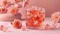 Refreshing pink lemonade with ice cubes and camellia flowers on a pink background