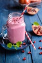 Pomegranate smoothie in a glass jar