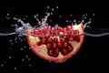 Fresh Red Pomegranate Bursting with Water Droplets, Juicy Pomegranate Splashing in Crystal Clear Water, Royalty Free Stock Photo