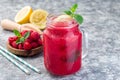 Refreshing raspberry, lemon and mint lemonade with sparkling water in a jar, horizontal, copy space Royalty Free Stock Photo