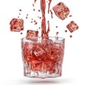 Refreshing Red Liquid Pours into a Glass of Ice Cubes Royalty Free Stock Photo