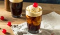 Refreshing Root Beer Float with Vanilla Ice Cream and Cherry on a Rustic Wooden Surface Royalty Free Stock Photo