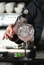 Refreshing ruby red coctail with grape fruit isolated on a bar b