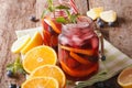 Refreshing sangria with orange, strawberry and blueberry closeup