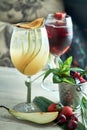 Refreshing sangria or punch with fruits in glass and pincher jpg Royalty Free Stock Photo