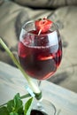 Refreshing sangria or punch with fruits in glass and pincher jpg Royalty Free Stock Photo