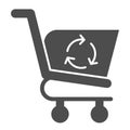 Refreshing shopping cart glyph icon. Market consumer basket with recycle sign. Commerce vector design concept, solid