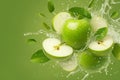Refreshing shot Water splashing on a crisp green apple surface Royalty Free Stock Photo