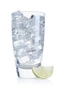 Refreshing soda water with ice cubes in glass and slice of lime isolated on white Royalty Free Stock Photo