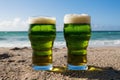 Refreshing St. Patrick's Day Celebration on the Beach with Two Green Beers Royalty Free Stock Photo