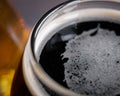 Refreshing stout beer with foam Royalty Free Stock Photo