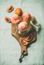 Refreshing summer blood orange ice cream on rustic wooden board Royalty Free Stock Photo