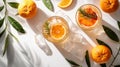 Refreshing summer citrus cocktail with orange slices and rosemary on a white background