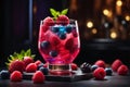 Refreshing summer cocktail with berries and mint on a black background