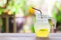 Refreshing summer cocktail-Honey lemon soda with lime slice in pitcher