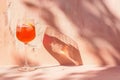 Refreshing summer cocktail on pink background, generative ai