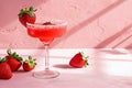 Refreshing summer cocktail, strawberry margarita, on pink background
