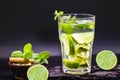 Refreshing summer cold lemonade mojito in a glass on a black background. Tourist drink, menu or restaurant image. Typical summer