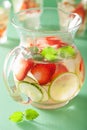 Refreshing summer drink with strawberry cucumber lime in jar and Royalty Free Stock Photo