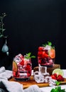 Refreshing summer drink with strawberry slices, lime, and mint leaf  in glasses on dark background beverage soda Royalty Free Stock Photo