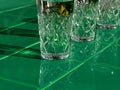 Refreshing summer drinks in crystal glasses on yellow bar tile background with harsh shadows Sweet cold natural cocktail