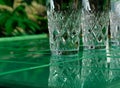 Refreshing summer drinks in crystal glasses on yellow bar tile background with harsh shadows Sweet cold natural cocktail