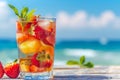 Refreshing summer fruit cocktail in glass on sunny beach for ultimate relaxation