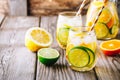 A refreshing summer ice-cold drink. White wine sangria in glass with lime, lemon and orange Royalty Free Stock Photo