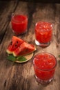 Refreshing summer watermelon juice in glasses with slices of watermelon Royalty Free Stock Photo