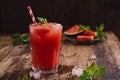 Refreshing summer watermelon juice in glasses with slices of watermelon