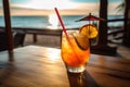 A refreshing, tropical cocktail, served in a stylish glass and garnished with a vibrant paper umbrella, fresh fruit, and a Royalty Free Stock Photo