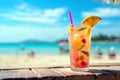 Refreshing tropical cocktail on a sunny beach with clear blue waters. Shallow depth of feld Royalty Free Stock Photo