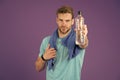 Refreshing vitamin drink after great workout. Man athletic hold water bottle. Handsome athlete drink water. Water Royalty Free Stock Photo