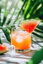 Refreshing watermelon cocktail with ice and mint on a sunny tropical background Royalty Free Stock Photo