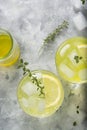 Refreshing yellow lemon glass of summer drink in glass. Soda lemonade drink, top view